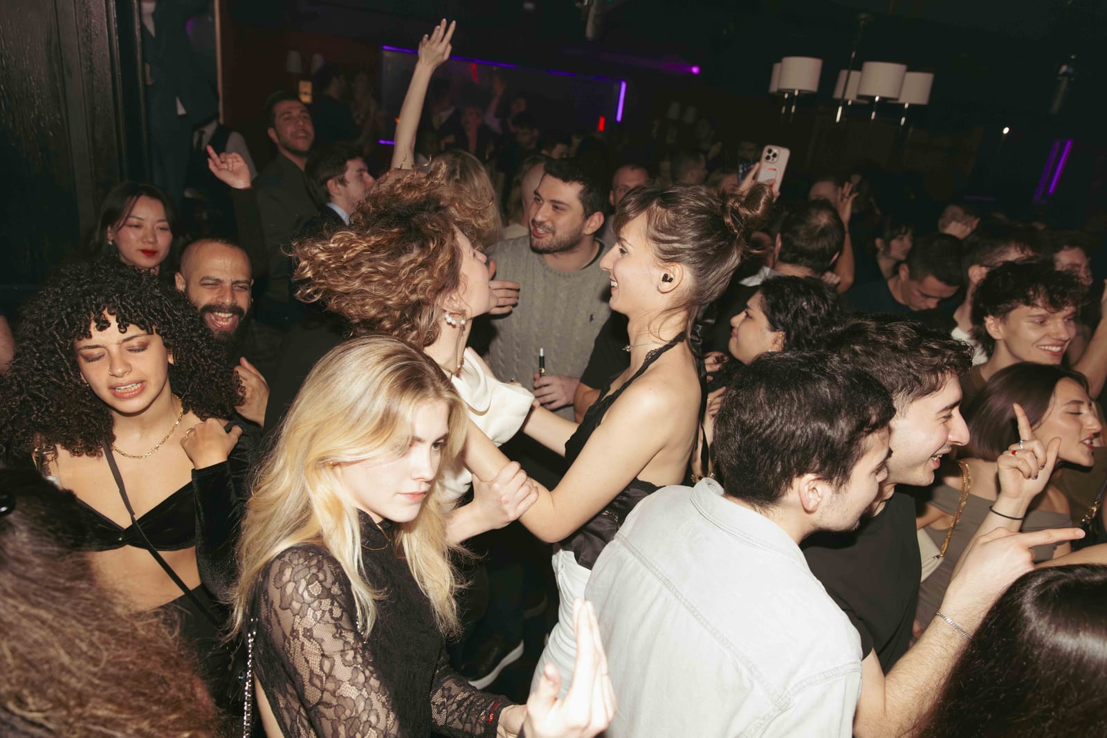 Intimate Mayfair club floor lit low during a funk and soul set